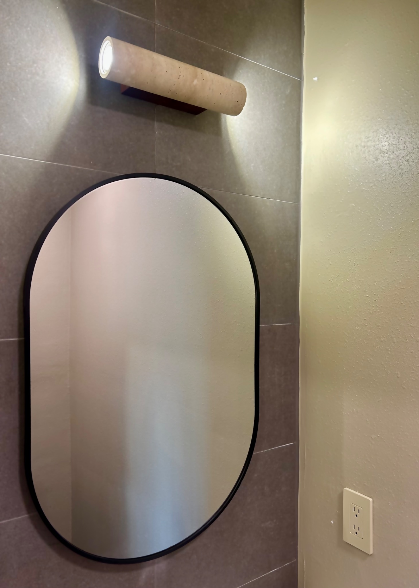 Mirror and wall sconce detail